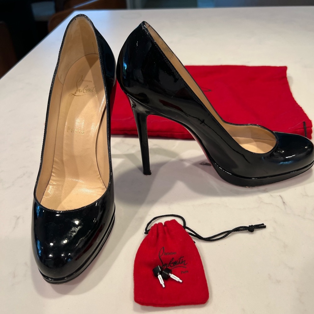 Christian Louboutin black, patent leather heels. Size 38.5. Very good condition.
